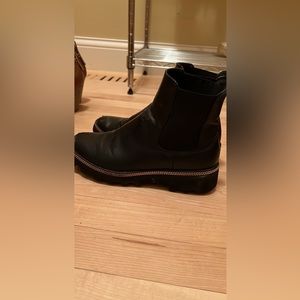 Black booties with gold accent. Size 7
